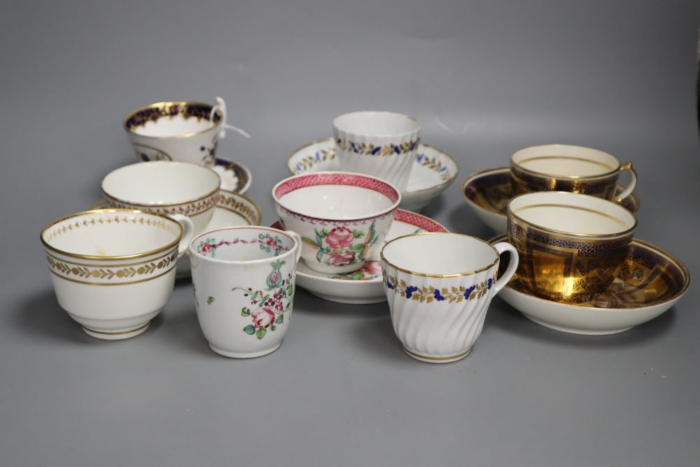 A pair of Miles Mason blue and gilt teacups and saucer, a documentary London handle cup and saucer pattern 2/1486 dated 1825